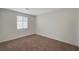 Bright bedroom featuring neutral walls, carpet, window, and ample natural light at 10198 Eden Mountain St, Las Vegas, NV 89141