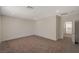 Bright bedroom boasts neutral walls and carpet, recessed lighting and an open doorway at 10198 Eden Mountain St, Las Vegas, NV 89141