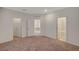 Large bedroom with three access doors and neutral carpet at 10198 Eden Mountain St, Las Vegas, NV 89141