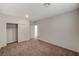Bedroom features neutral walls, carpet flooring, and closet for efficient storage at 10198 Eden Mountain St, Las Vegas, NV 89141