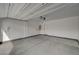 Spacious two-car garage with concrete flooring and door to interior at 10198 Eden Mountain St, Las Vegas, NV 89141
