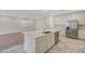 Spacious kitchen featuring stainless appliances, a large island and access to the living area at 10198 Eden Mountain St, Las Vegas, NV 89141
