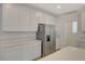 Bright kitchen featuring stainless appliances, white cabinets, and quartz countertops at 10198 Eden Mountain St, Las Vegas, NV 89141