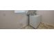 Convenient laundry room features tile floors and modern washer and dryer at 10198 Eden Mountain St, Las Vegas, NV 89141