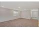 Neutral living room with carpet flooring, recessed lighting, and a large window that provides ample light at 10198 Eden Mountain St, Las Vegas, NV 89141