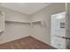 Walk-in closet with a view of the attached bathroom features shelving, rod space and carpet floors at 10198 Eden Mountain St, Las Vegas, NV 89141