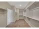 Spacious walk-in closet offering ample shelving and rod space for organization, with carpet floors at 10198 Eden Mountain St, Las Vegas, NV 89141