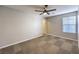 Bedroom with a neutral color palette, ceiling fan, and carpet at 10506 Arnica Way, Las Vegas, NV 89135