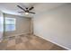 Bedroom with a neutral color palette and a ceiling fan at 10506 Arnica Way, Las Vegas, NV 89135