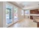 Bright dining area featuring tile flooring, backyard access and a view of the pool at 10506 Arnica Way, Las Vegas, NV 89135