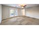 Well-lit living room leading to balcony with great natural light at 10506 Arnica Way, Las Vegas, NV 89135