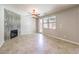 Inviting living area with tile floors, ceiling fan, fireplace, and outdoor access at 10506 Arnica Way, Las Vegas, NV 89135