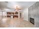 Inviting living area with tile floors, open layout, and a stylish fireplace feature at 10506 Arnica Way, Las Vegas, NV 89135