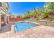 Sparkling pool surrounded by lush landscaping and hardscape, perfect for outdoor relaxation and entertainment at 10506 Arnica Way, Las Vegas, NV 89135