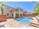 Relaxing backyard showcasing a refreshing pool, spa, covered patio, lush greenery offering a private outdoor retreat for enjoyment at 10506 Arnica Way, Las Vegas, NV 89135
