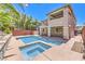 Stunning backyard featuring a pool with integrated spa, covered patio, two story home and mature trees for ultimate privacy and shade at 10506 Arnica Way, Las Vegas, NV 89135