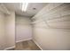 Walk-in closet with carpet and wall-mounted metal shelving at 10506 Arnica Way, Las Vegas, NV 89135
