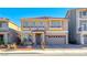 Charming two-story home featuring a tile roof, neutral stucco, and attached two-car garage at 10598 Aphrodite St, Las Vegas, NV 89183