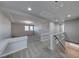 Upstairs loft area featuring neutral paint, carpet, recessed lighting and natural light at 10598 Aphrodite St, Las Vegas, NV 89183