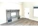 Inviting entryway with custom storage, coat hooks, and light wood flooring at 10908 Royal Highlands St, Las Vegas, NV 89141
