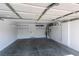 Spacious two-car garage with ample storage shelving and water heater at 10908 Royal Highlands St, Las Vegas, NV 89141
