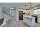 Bright kitchen with stainless steel appliances and large island with breakfast bar at 10908 Royal Highlands St, Las Vegas, NV 89141