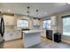 Bright kitchen with stainless steel appliances, countertops, and a view of the backyard at 10908 Royal Highlands St, Las Vegas, NV 89141