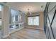 Bright living room with hardwood floors, modern lighting, and a decorative fireplace at 10908 Royal Highlands St, Las Vegas, NV 89141