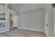 Open floor plan featuring light wood floors, a staircase, and a connecting view to other living spaces at 10908 Royal Highlands St, Las Vegas, NV 89141