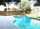 Beautiful swimming pool with manicured yard and privacy wall at 10908 Royal Highlands St, Las Vegas, NV 89141
