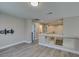 Spacious room with hardwood floors, neutral paint, and a wall-mounted tv bracket at 10908 Royal Highlands St, Las Vegas, NV 89141