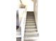 Carpeted staircase with white banister at 10908 Royal Highlands St, Las Vegas, NV 89141