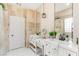 Spa-like bathroom features double vanity, tile walls and large mirrors at 11764 Golden Moments Ave, Las Vegas, NV 89138