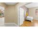 Cozy bedroom features wood floors, ensuite bathroom and lots of natural light at 11764 Golden Moments Ave, Las Vegas, NV 89138