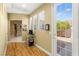 Inviting entryway features a glass paneled door, light tan walls, and views to other parts of the home at 11764 Golden Moments Ave, Las Vegas, NV 89138