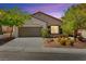 Charming single-story home with a two-car garage and well-manicured landscaping at 11764 Golden Moments Ave, Las Vegas, NV 89138