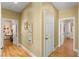 Bright hallway showing two doors and a decorative print on the wall at 11764 Golden Moments Ave, Las Vegas, NV 89138
