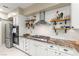 Modern kitchen with white cabinets, granite countertops, and stainless steel appliances at 11764 Golden Moments Ave, Las Vegas, NV 89138