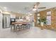 Spacious kitchen with stone accent wall, large island with seating and stainless steel appliances at 11764 Golden Moments Ave, Las Vegas, NV 89138