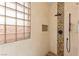 Modern glass enclosed shower with pebble accents, stone tile, and modern fixtures at 11764 Golden Moments Ave, Las Vegas, NV 89138