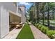 Backyard with a covered patio, turf, and low-maintenance gravel landscaping at 11775 Woodbrook Ct, Las Vegas, NV 89141