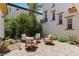 Picturesque courtyard with a charming seating area amidst lush greenery at 11775 Woodbrook Ct, Las Vegas, NV 89141