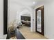 Elegant entryway with arched doorway, tiled floors, and a view into the kitchen and dining area at 11775 Woodbrook Ct, Las Vegas, NV 89141
