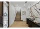 Bright entryway with hardwood floors, staircase, and decorative front door with glass detailing at 11775 Woodbrook Ct, Las Vegas, NV 89141