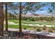 Scenic view of the golf course with mature trees and mountain views at 11775 Woodbrook Ct, Las Vegas, NV 89141