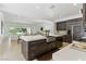 Bright and spacious kitchen with an open layout to the living area, featuring a large island and modern appliances at 11775 Woodbrook Ct, Las Vegas, NV 89141