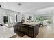 Modern kitchen featuring a stone farmhouse sink, stainless steel appliances, and an open layout at 11775 Woodbrook Ct, Las Vegas, NV 89141