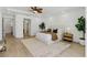 Spacious main bedroom features a tray ceiling, light wood floors, and bright, neutral decor at 11775 Woodbrook Ct, Las Vegas, NV 89141