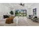 Comfortable main bedroom with access to an outdoor seating area overlooking lush greenery at 11775 Woodbrook Ct, Las Vegas, NV 89141