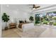 Bright and airy main bedroom featuring golf course views from a large sliding glass door at 11775 Woodbrook Ct, Las Vegas, NV 89141